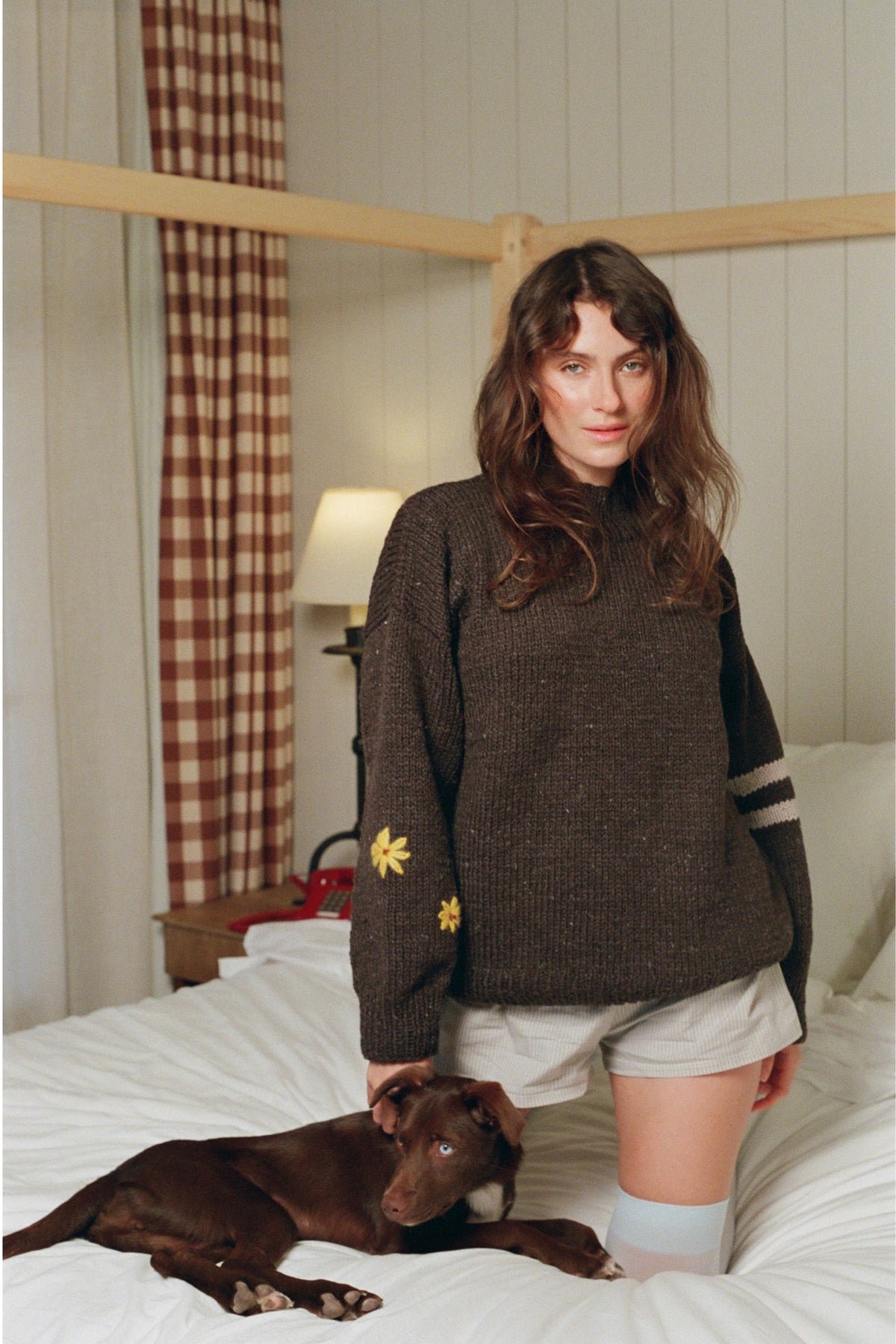 Front of the Buster Brown Best Buds sweater by Made by Minga with flowers on one sleeve and stripes on the other