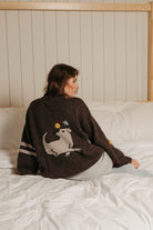 Back of the Buster Brown alpaca wool sweater with dog and bird graphic and two cream sleeve stripes