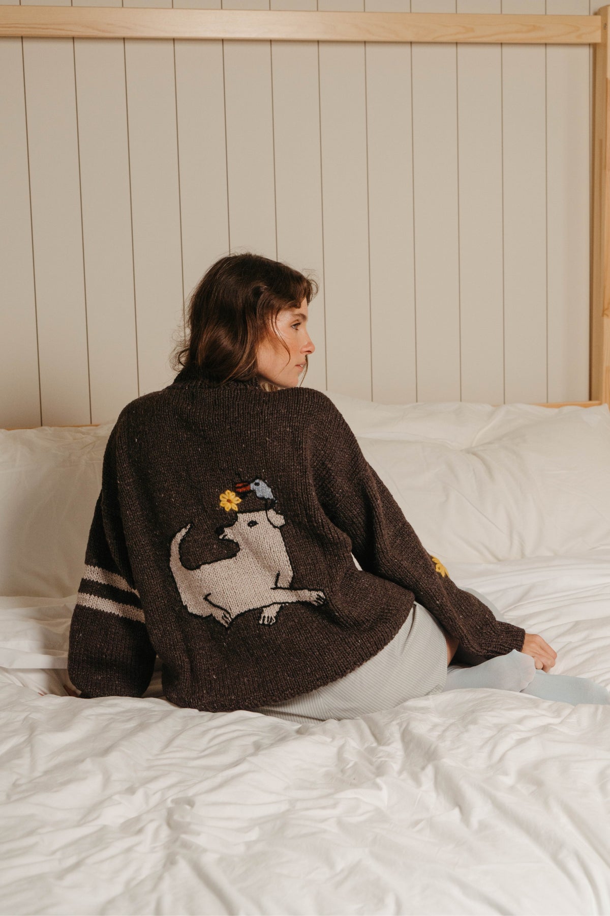 Back of the Buster Brown alpaca wool sweater with dog and bird graphic and two cream sleeve stripes